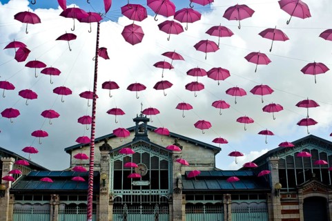 Breast cancer campaign, pink umbrellas in the sky at La Rochelle, France, Europe