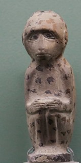 Aryballos, Ceramic vessel, Ancient sculpture of a monkey with dotted pattern against a green