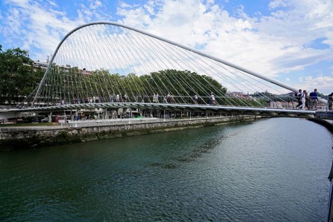 Pedestrian bridge Zubizuri, White Bridge, Bilbao, Modern pedestrian bridge over a river Nervion,