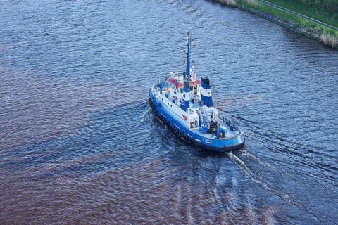 Bird's eye view of the Fairplay-54 tugboat on the Kiel Canal near Beldorf, Rendsburg-Eckernfoerde
