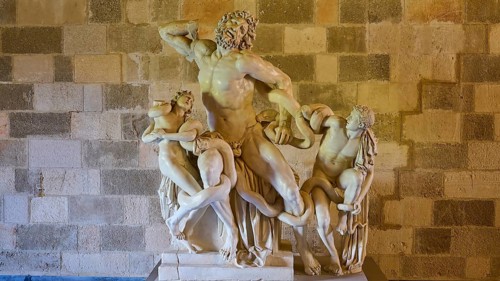 Copy of the Laocoon Group, marble sculpture depicting a dynamic mythological battle, interior view,