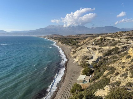 View from elevated position point of view on aerial view of beach of Komos Beach on south coast of