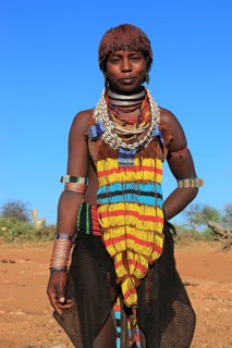 South Ethiopia, Omo region, young woman of the Hammer people, wears a lot of jewellery and her hair