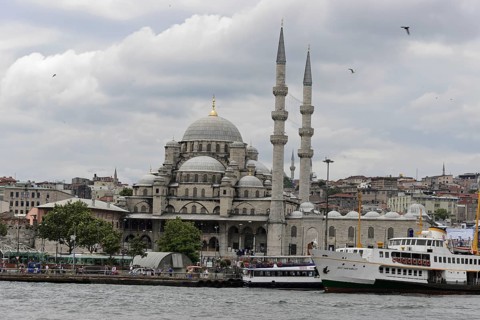 View of the New Mosque on the shore with ships and flying birds, Istanbul, Istanbul Province,