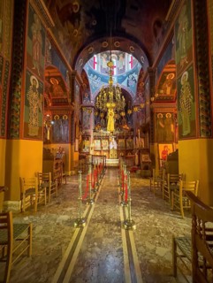 Chancel interior of orthodox church with in the background chandelier chandelier under dome of