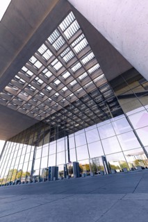 Entrance area of a modern building with glass facades and concrete elements, Berlin, Germany,