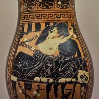 Antique Greek vase with picture of lovers in an intimate embrace, dog under the table, interiors,