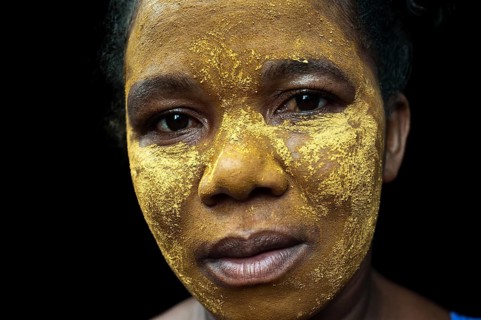Portrait of a woman with traditional beauty mask, Mananjary, Madagascar, Africa