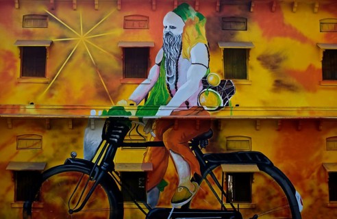 Mural painting depicting a hindu ascetic riding a cycle, Allahabad, India, Asia