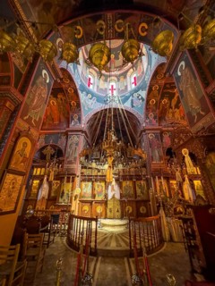 Chancel interior of orthodox church with in the background chandelier chandelier under dome of