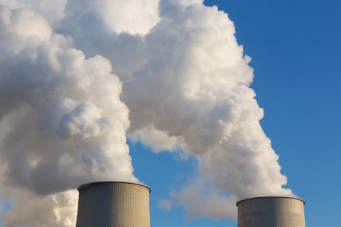 Steam rises from the cooling towers of the Vattenfall power plant in Jaenschwalde on 9 December