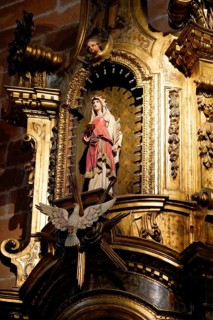 The Iglesia de San Anton church on the Nervion river in Bilbao, A religious statue on an ornate