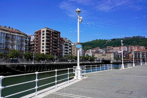 On the road in Bilbao, Bizkaia province, Basque Country, Spain, Europe, River bank with buildings