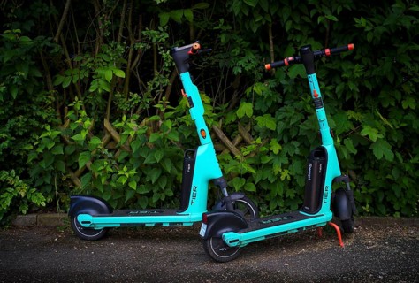 E-scooters parked at the side of the road in the TIER bike hire centre, Stuttgart,