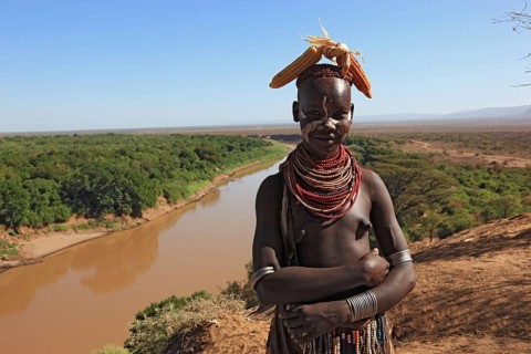 Southern Ethiopia, Omo region, Omo river landscape, proud woman of the Karo people with headdress,