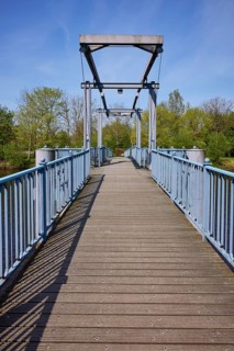 Blue bridge over the Westersielzug in Friedrichstadt, district of Nordfriesland,