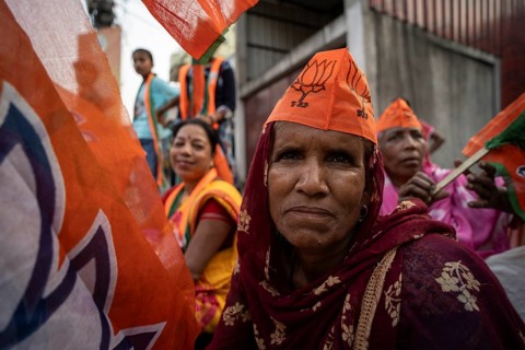 Bharatiya Janata Party (BJP) supporters arrives to to see a roadshow of Union Home minister Amit