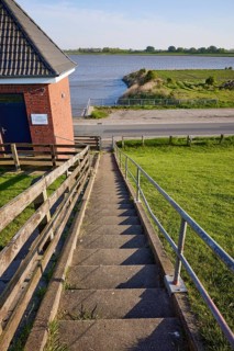 Steps to the dyke crest on the dyke near Tetenbuell, North Friesland district, Schleswig-Holstein,