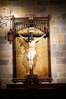 The Iglesia de San Anton church on the Nervion river in Bilbao, A statue of Christ depicting the