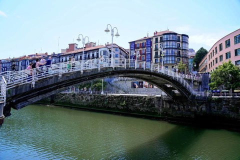 On the road in Bilbao, Bizkaia province, Basque Country, Spain, Europe, Stone bridge over a river