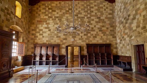 Elegant room with chandelier and antique wooden furniture, interior view, Grand Master's Palace,
