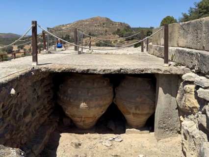 View into historical storeroom below present floor level with two large decorated clay vessels