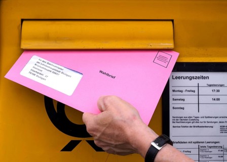 Postal ballot, letterbox, insert ballot paper envelope, light red, pink, European elections,