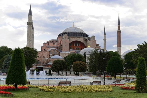 The Hagia Sophia, visible via bubbling water fountains and surrounded by green spaces, Istanbul