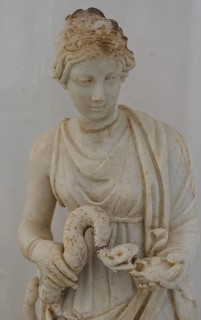 Small statue, Goddess Hygieia with snake, marble sculpture of a woman with snake, dressed in