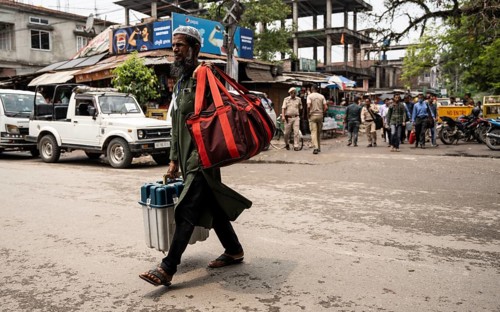 Barpeta, India. 6 May 2024. Polling officials carries Electronic Voting Machines (EVMs) and Voter