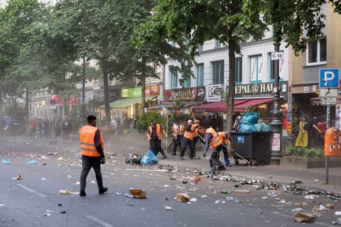 Employees of a cleaning service clean Gneisenaustrasse after the street parade of the 26th Carnival