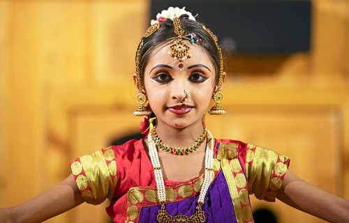 Indian dancer, 10 years old, dancing Indian classical dance, close-up, Thekkady, Kerala, India,