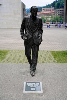 Sculpture of a man in a suit RAMON RUBIAL CAVIA, Presidente del PSOE 1906-1999, with an information