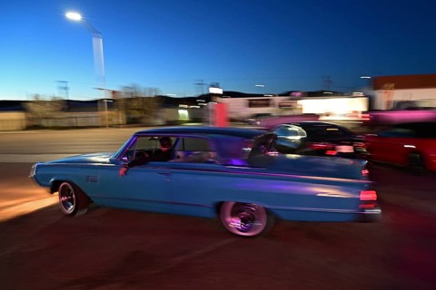 A 1964 Mercury Monterey turns onto Route 66 in the evening light, Gallup, New Mexico
