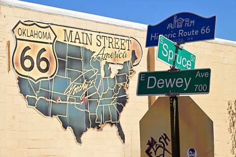 Street sign with road map on the wall of a house on Route 66, Tulsa Oklahoma