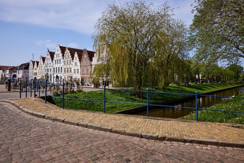 The Great Bridge over the Mittelburggraben with gabled houses and cobbled street in Friedrichstadt,