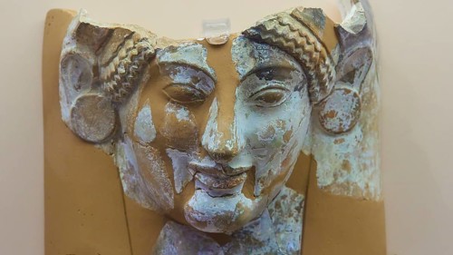 Female terracotta bust, A damaged ancient stone relief of a female face, Interior, Archaeological