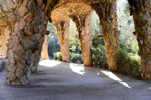 Park Gueell, Barcelona, Catalonia, Spain, Europe, Light and shadow under stone arches in a park,