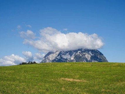 Meadow, clouds over mountain peak, Grimming, near Aigen im Ennstal, Styria, Austria, Europe