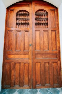 Details of a Spanish wooden door. Spanish style medieval wooden door