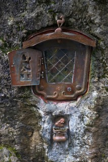 Memorial shrine in a rock, commemoration of an accident during a cattle drive, gabled house,