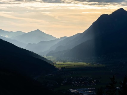 Sunlight falls on the Liesingtal valley and the village of Traboch, Schoberpass federal road, view