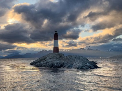 Lighthouse Faro Les Eclaireurs at sunset, dramatic clouds, Beagle Channel, Tierra del Fuego, Tierra