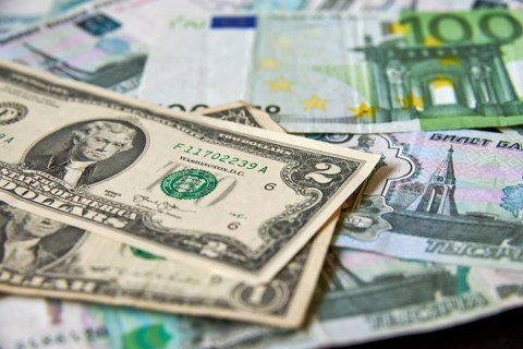 Background of paper bills dollars, euros and rubles. Currency exchange rate