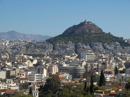City view with buildings and a hill in the background in clear weather, Ancient buildings with