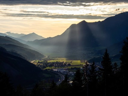 Sunlight falls on the Liesingtal valley and the village of Traboch, Schoberpass federal road, view