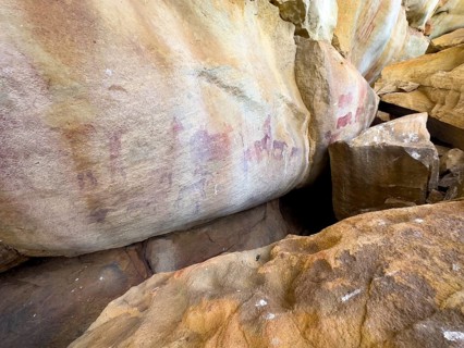 Prehistoric depiction of various people and animals on a rock, San rock paintings, Sevilla Art Rock