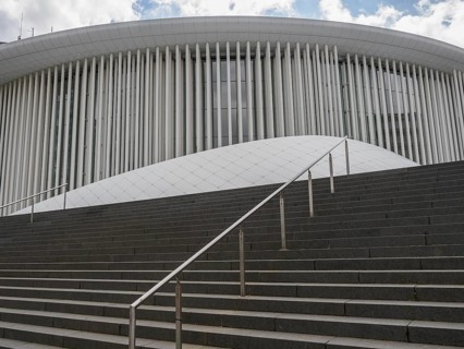 Cantilevered columns and curved shapes characterise the architecture of a modern building in