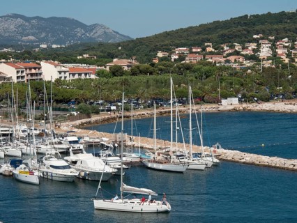 Marina with sailboats and mountains in the background in a picturesque coastal town, la seyne sur