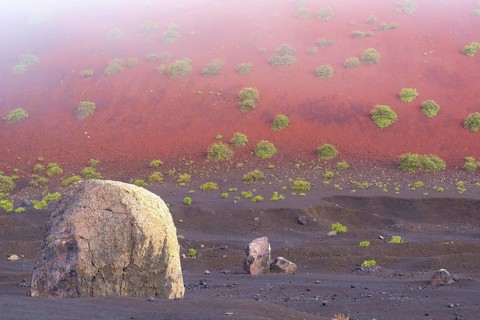 Lava bomb in front of Caldera Colorada, Parque Natural de Los Volcanes, near Masdache, Lanzarote,